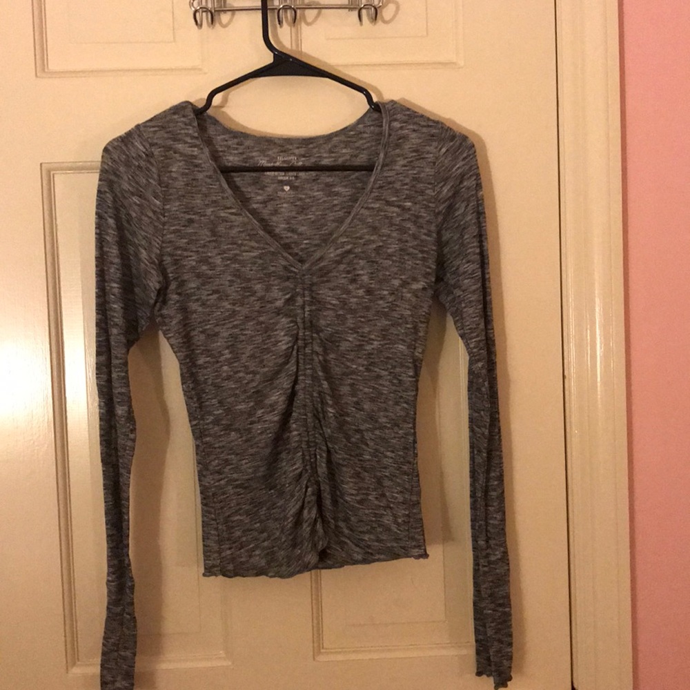 Grey shirt.
